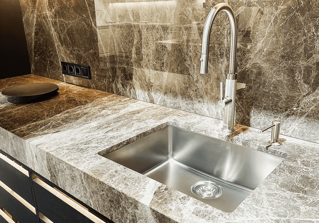Modern kitchen sink with marble countertop